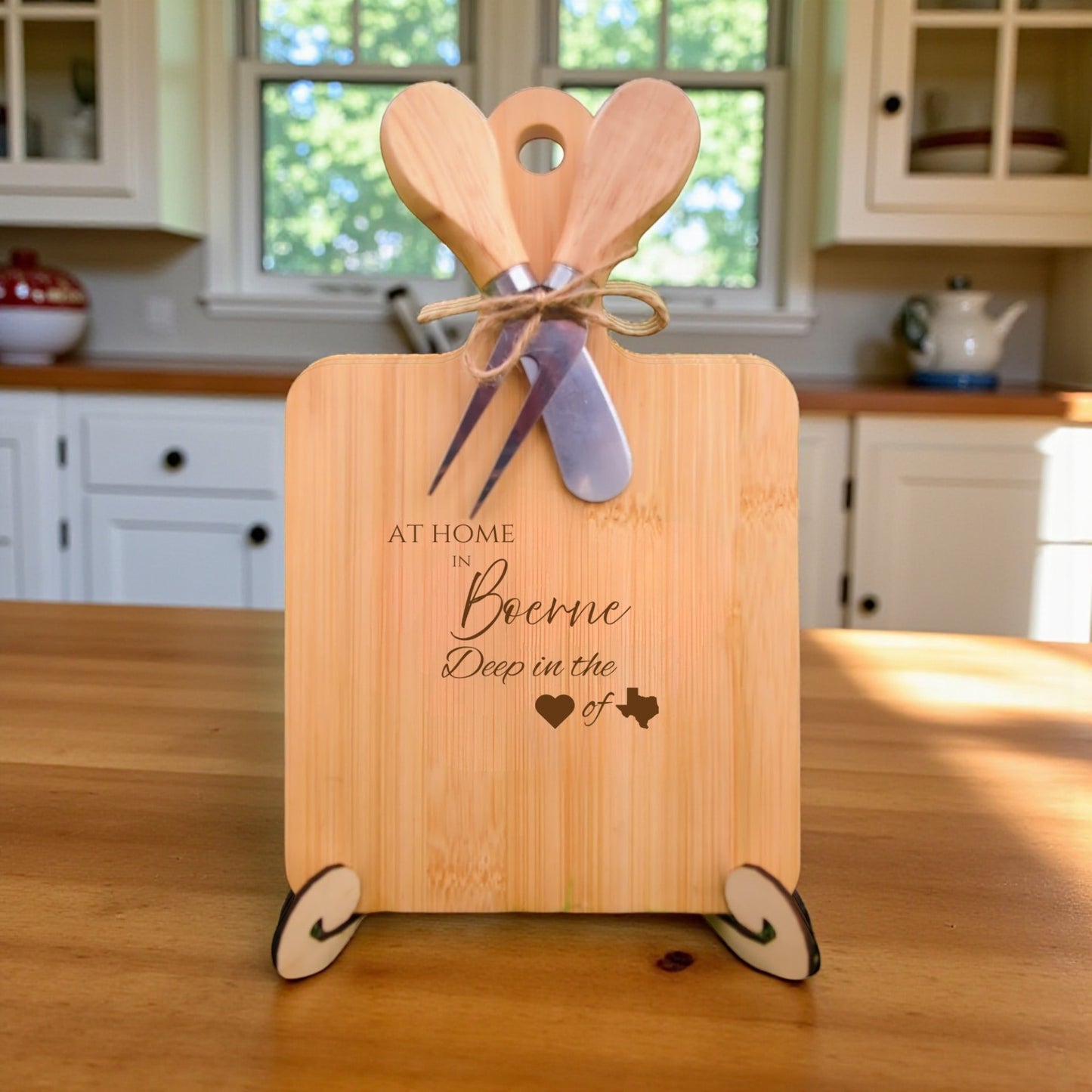 The At Home in Boerne Charcuterie Board with laser-engraved Texas silhouette and “At Home in Boerne” text, displayed in a cozy kitchen, ideal for entertaining and Texas pride.