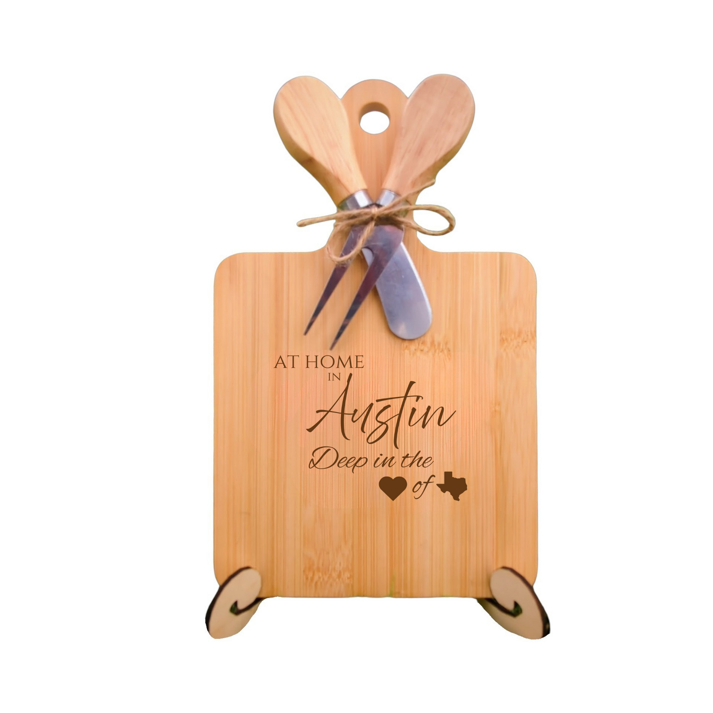 Elegant bamboo charcuterie board with utensils, engraved with “At Home in Austin, Deep in the Heart of Texas.