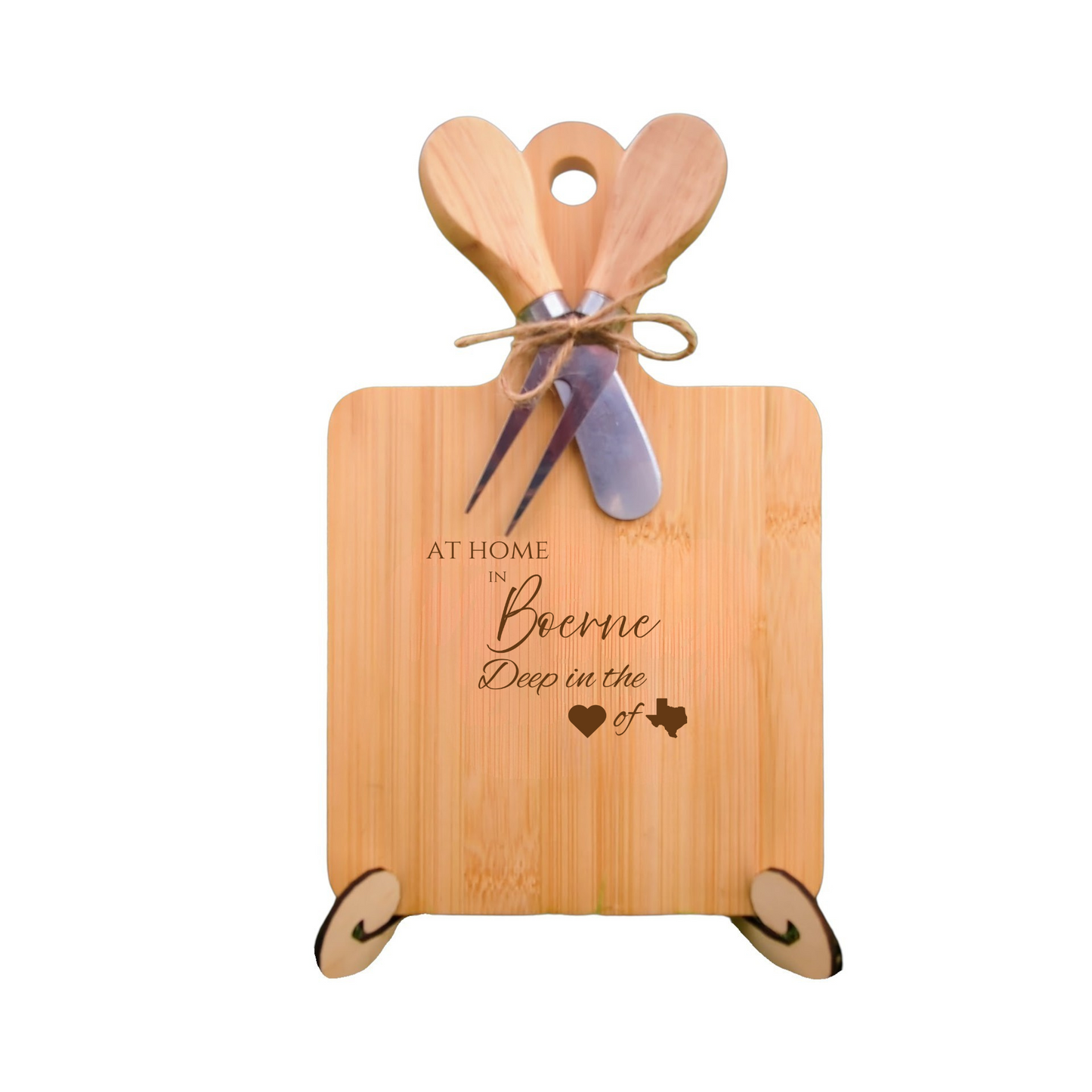 Elegant bamboo charcuterie board with utensils, engraved with “At Home in Boerne, Deep in the Heart of Texas.”