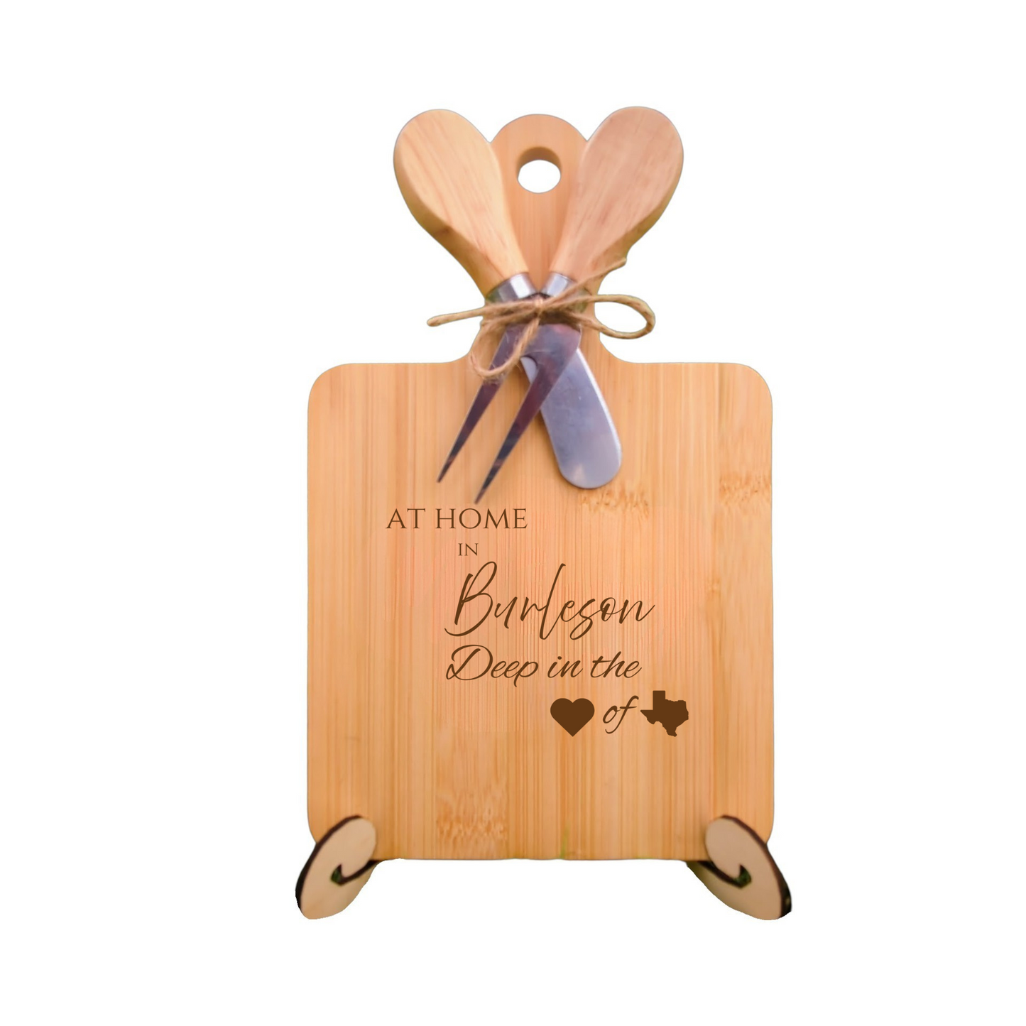 Elegant bamboo charcuterie board with utensils, engraved with “At Home in Burleson, Deep in the Heart of Texas.”