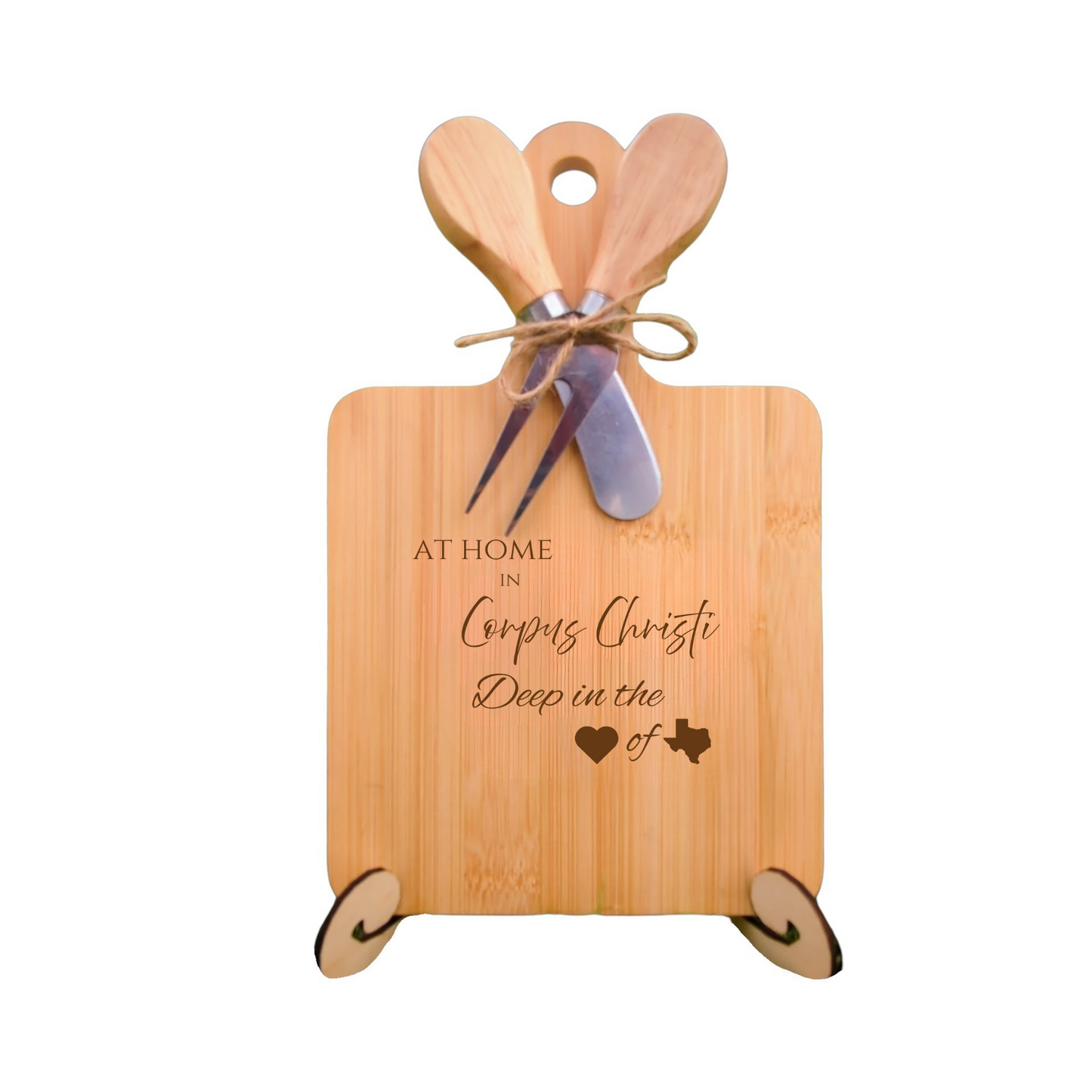 Elegant bamboo charcuterie board with utensils, engraved with “At Home in Corpus Christi, Deep in the Heart of Texas.”