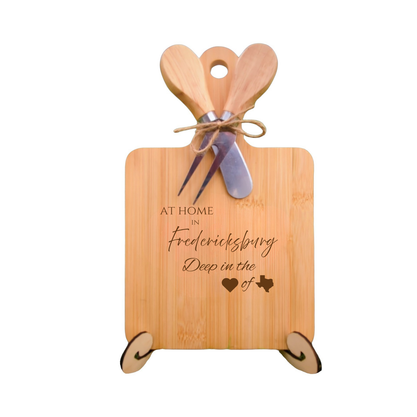 Elegant bamboo charcuterie board with utensils, engraved with “At Home in Fredericksburg, Deep in the Heart of Texas.”