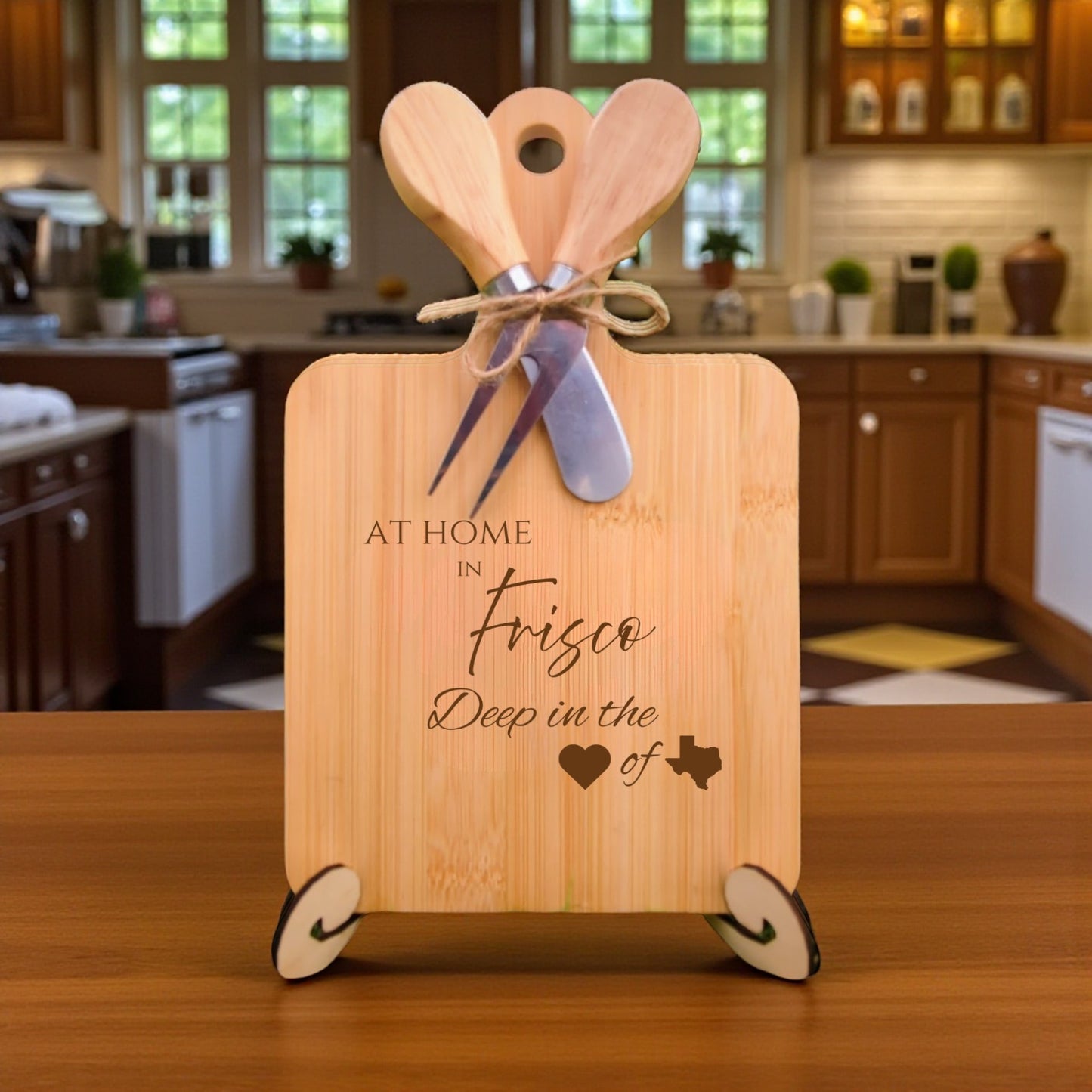 Bamboo charcuterie board engraved with “At Home in Frisco, Deep in the Heart of Texas” displayed in a kitchen setting.