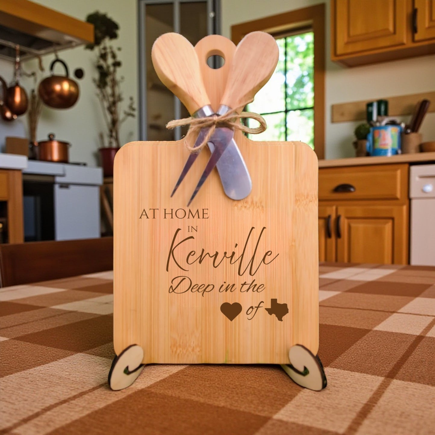 Bamboo charcuterie board engraved with “At Home in Kerrville, Deep in the Heart of Texas” displayed in a kitchen setting.