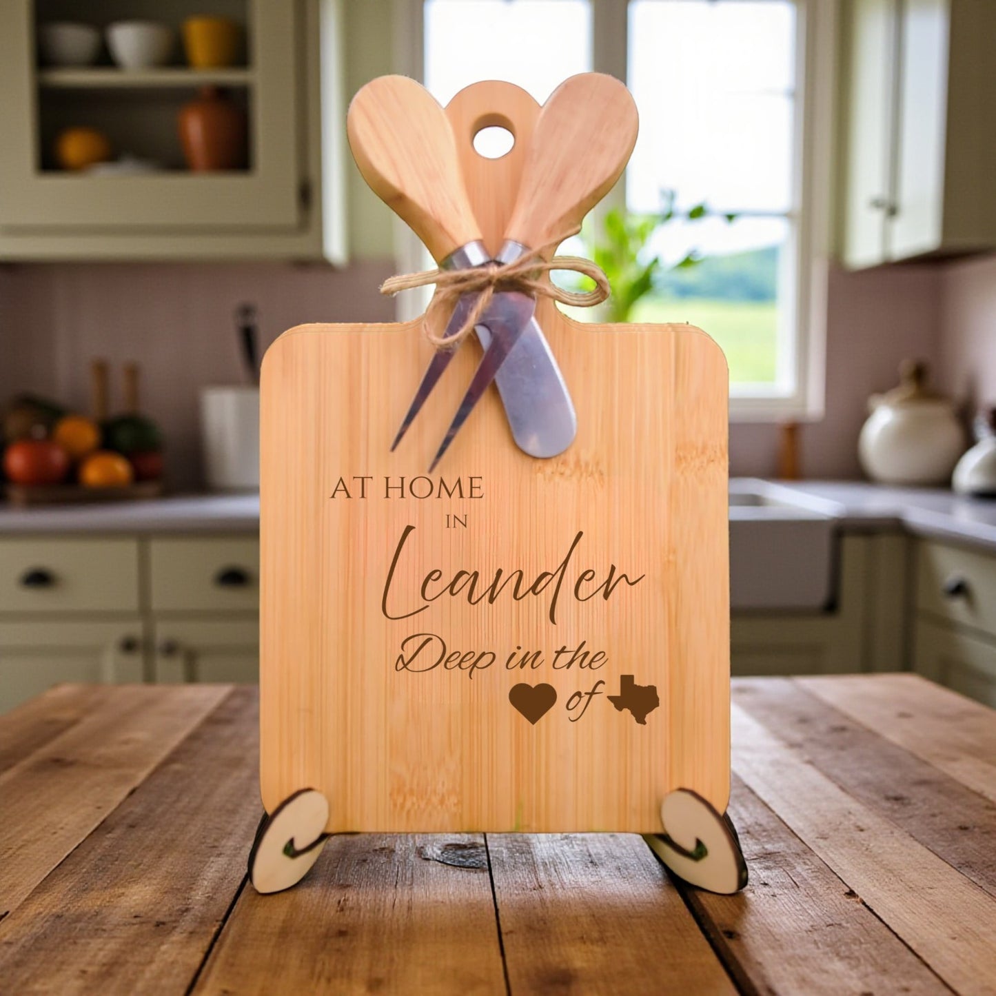 Bamboo charcuterie board engraved with “At Home in Leander, Deep in the Heart of Texas” displayed in a kitchen setting.