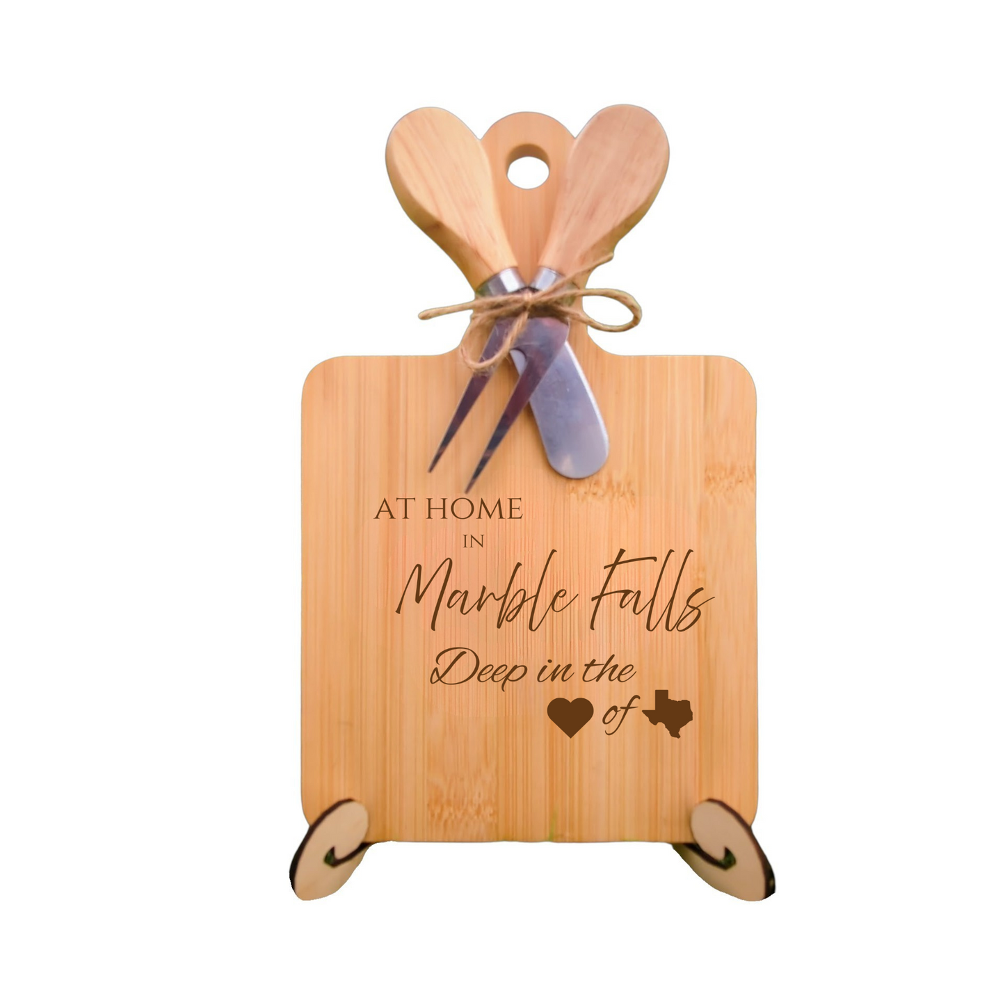 Elegant bamboo charcuterie board with utensils, engraved with “At Home in Marble Falls, Deep in the Heart of Texas.”
