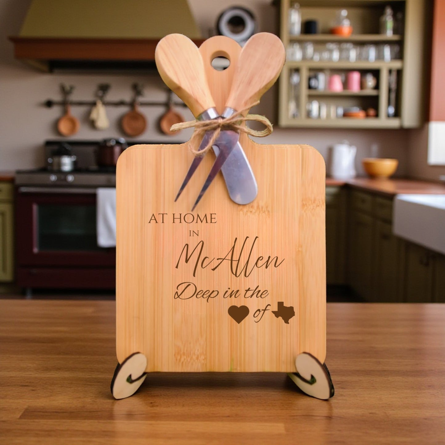 Bamboo charcuterie board engraved with “At Home in McAllen, Deep in the Heart of Texas” displayed in a kitchen setting.