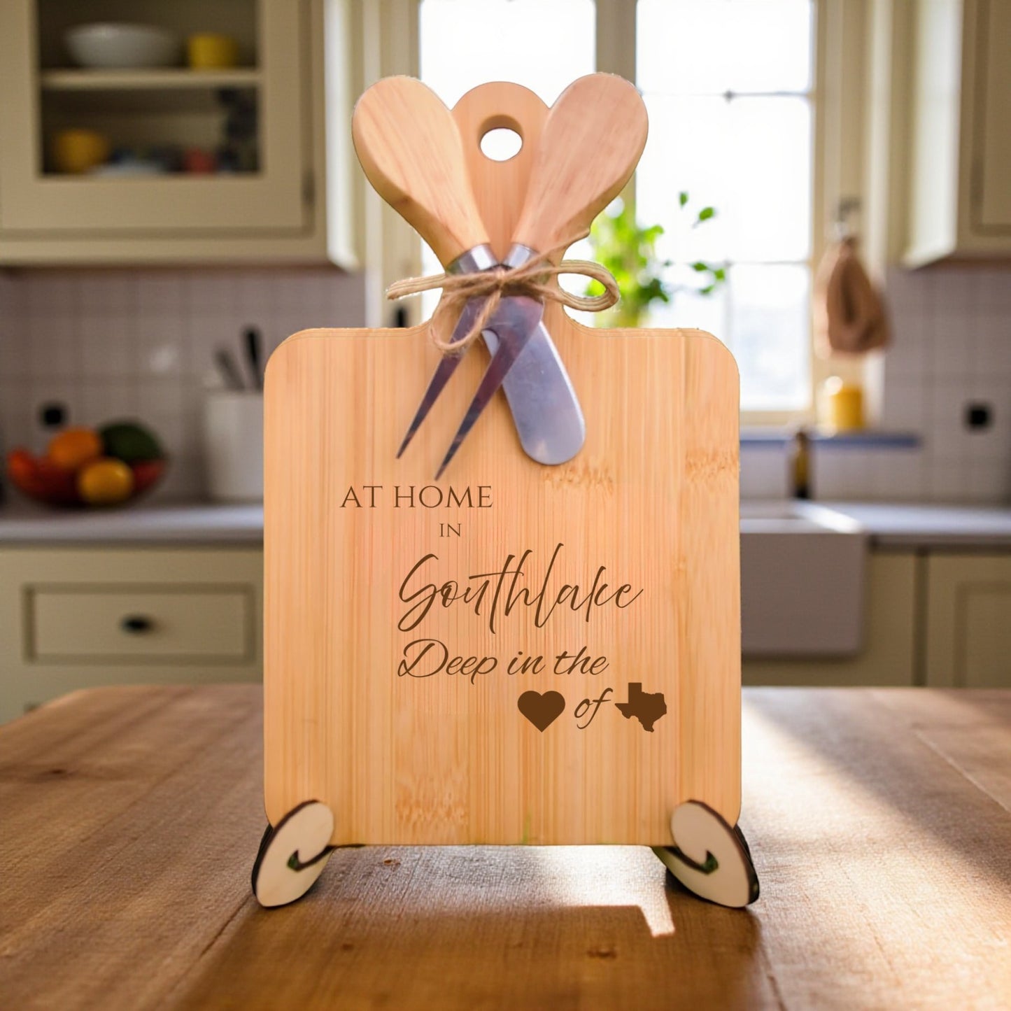 Bamboo charcuterie board engraved with “At Home in Southlake, Deep in the Heart of Texas” displayed in a kitchen setting.