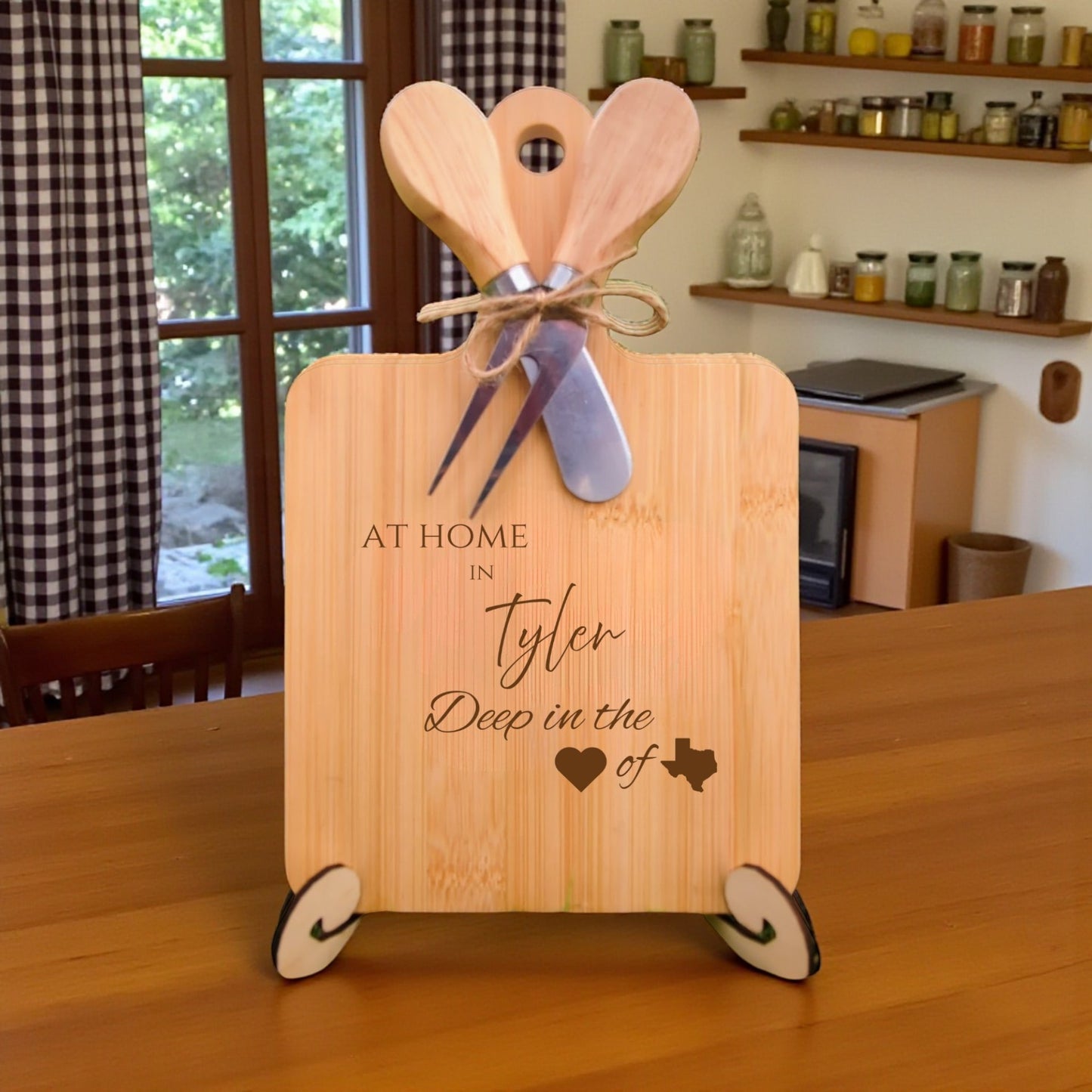 Bamboo charcuterie board engraved with “At Home in Tyler, Deep in the Heart of Texas” displayed in a kitchen setting.