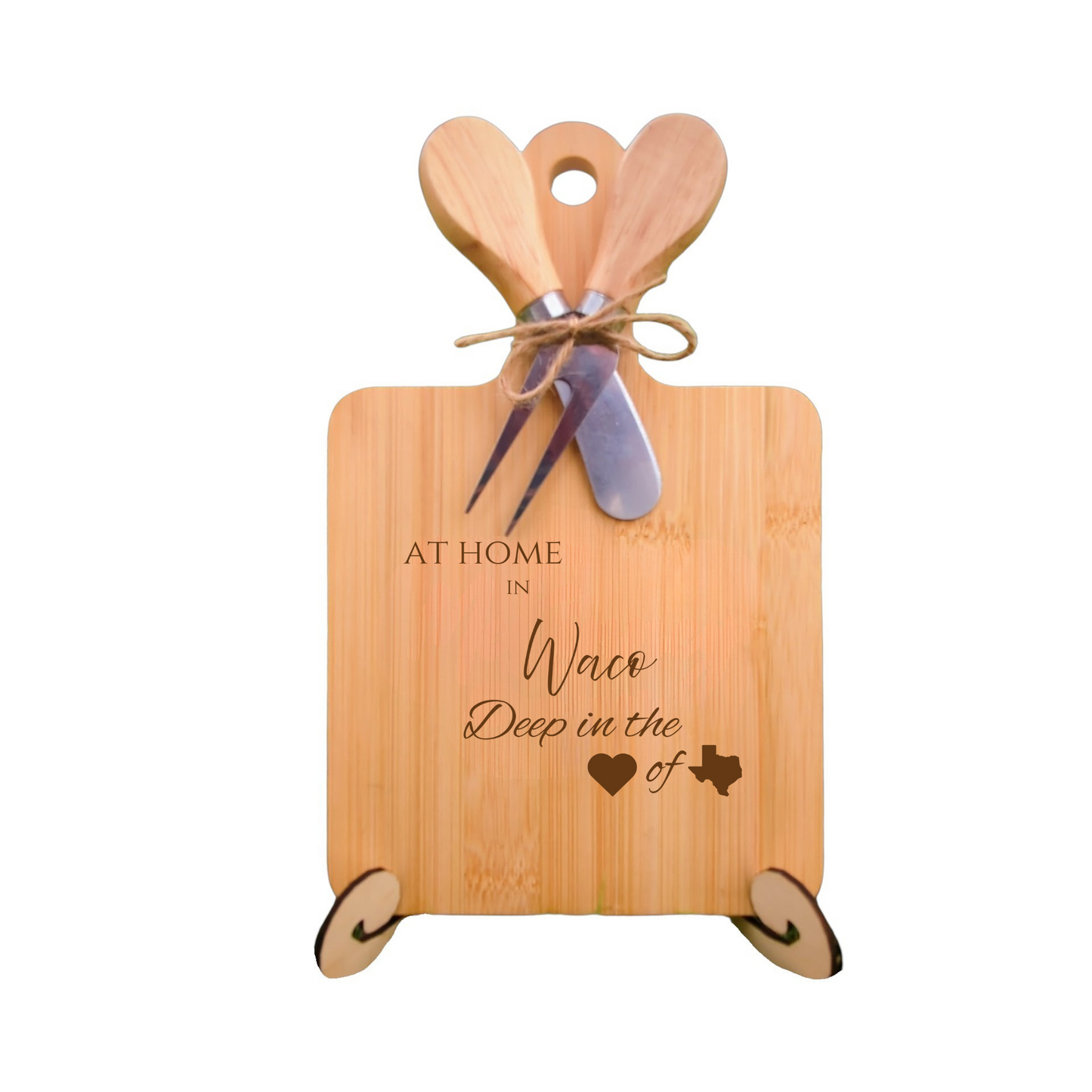 Elegant bamboo charcuterie board with utensils, engraved with “At Home in Waco, Deep in the Heart of Texas.”