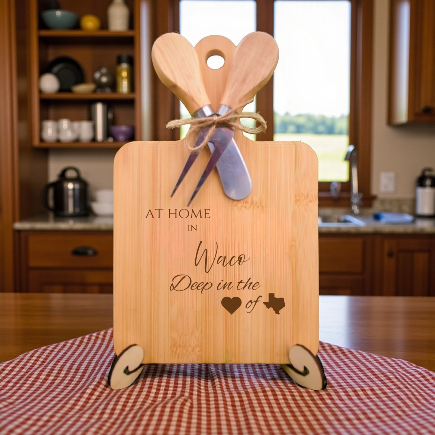 Bamboo charcuterie board engraved with “At Home in Waco, Deep in the Heart of Texas” displayed in a kitchen setting.