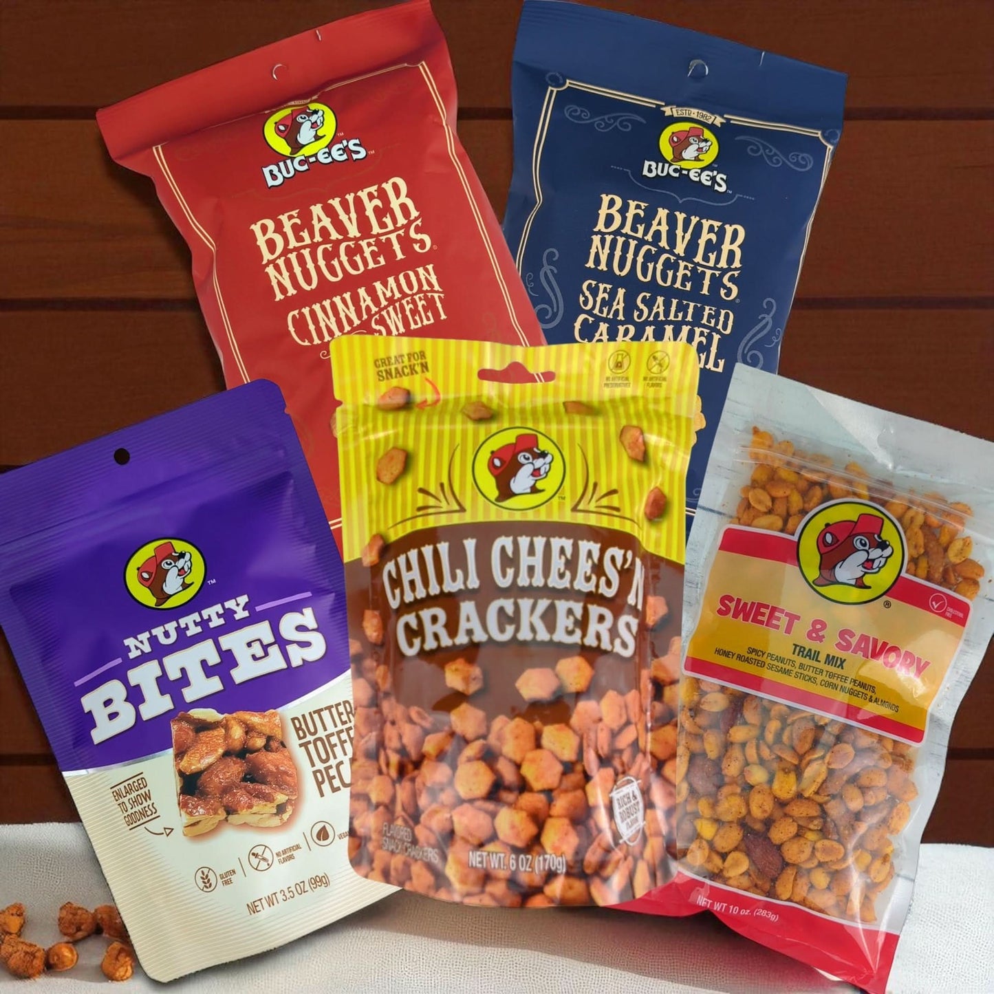 a buc-ees thamed array of snacks including beaver nuggets, trail mix, and more