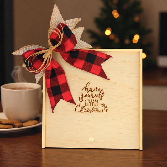 Create Your Own Have Yourself a Merry Little Christmas Wood Gift Box with a festive red and black checkered bow, featuring a “Have Yourself a Merry Little Christmas” design, with a warm holiday backdrop including a coffee cup and Christmas tree.