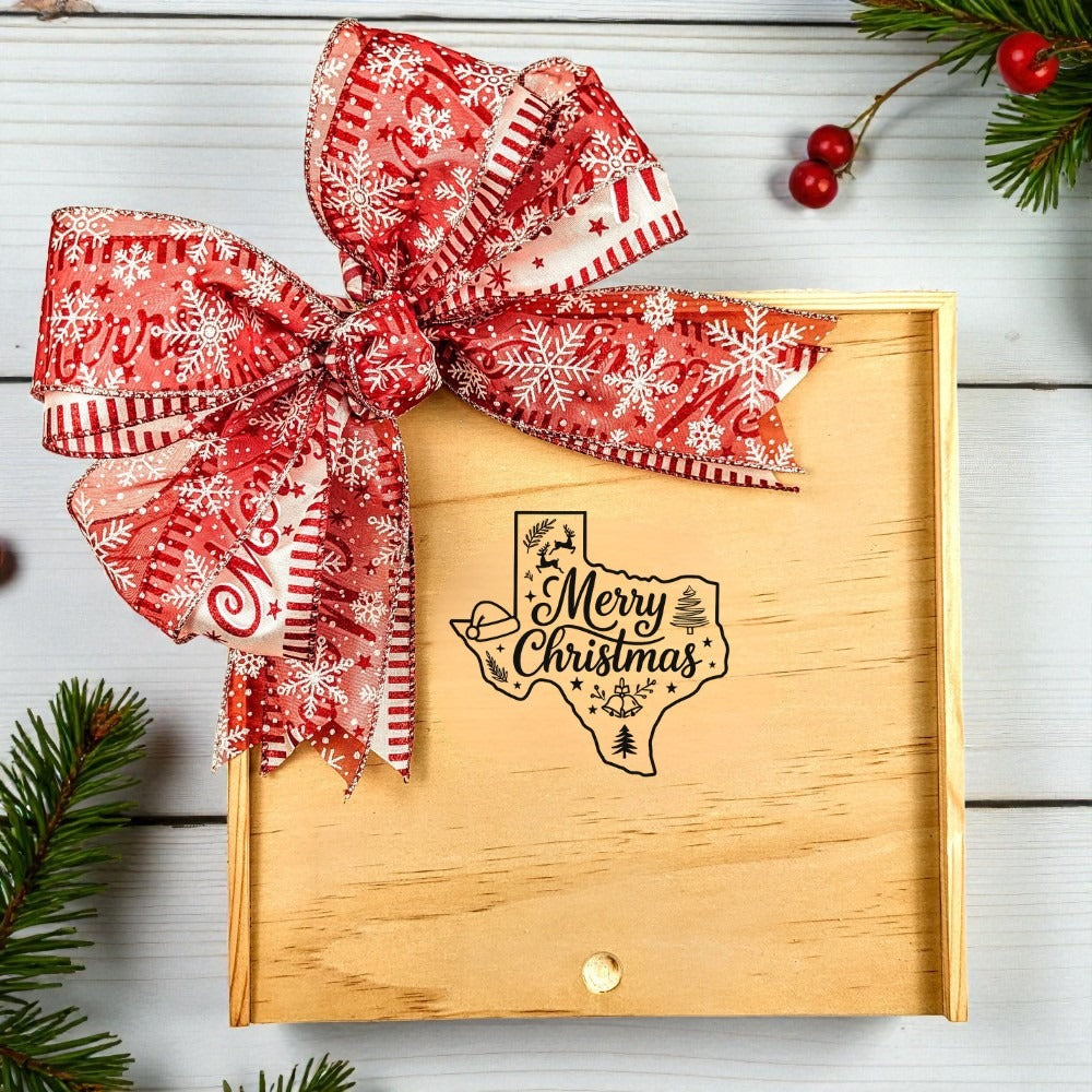 Create Your Own Merry Christmas Wooden Gift Box with a festive red snowflake bow and a “Merry Christmas” Texas design, surrounded by holiday greenery and seasonal decorations.