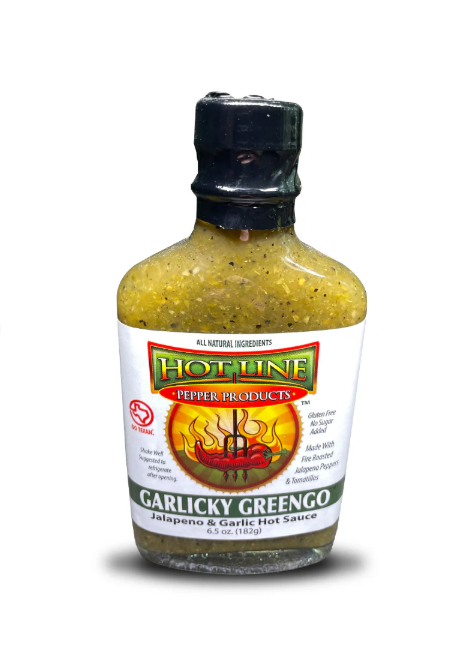Hot Line Garlicky Greengo Sauce in a sleek bottle with fire-roasted jalapeños and garlic, displayed against a plain white background as part of a Texas gift collection.