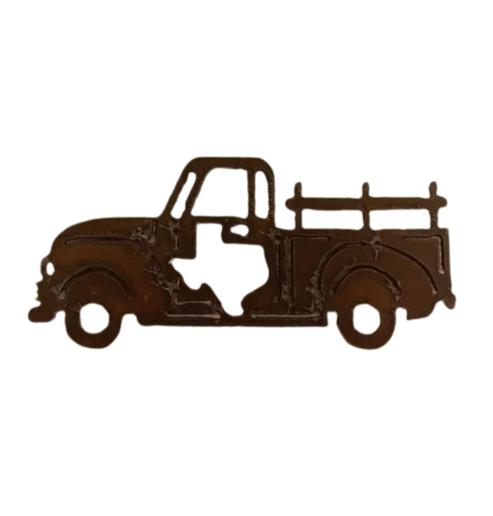 A rusted Vintage Pickup Truck Magnet with a Texas cutout design by Universal Ironworks Inc. sits against a weathered wooden background, showcasing its handcrafted, USA-made steel finish.