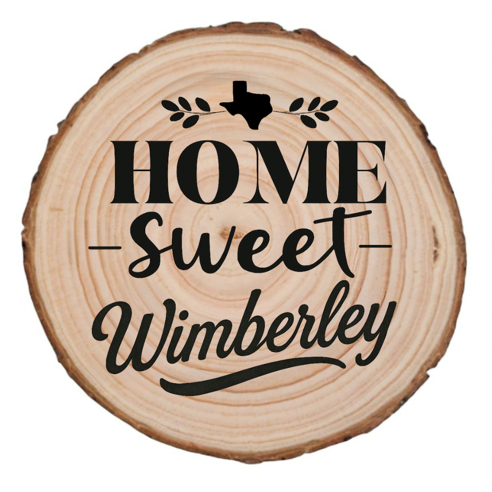 Natural wood slice coaster with “Home Sweet Wimberley” laser engraving and Texas silhouette on white background.