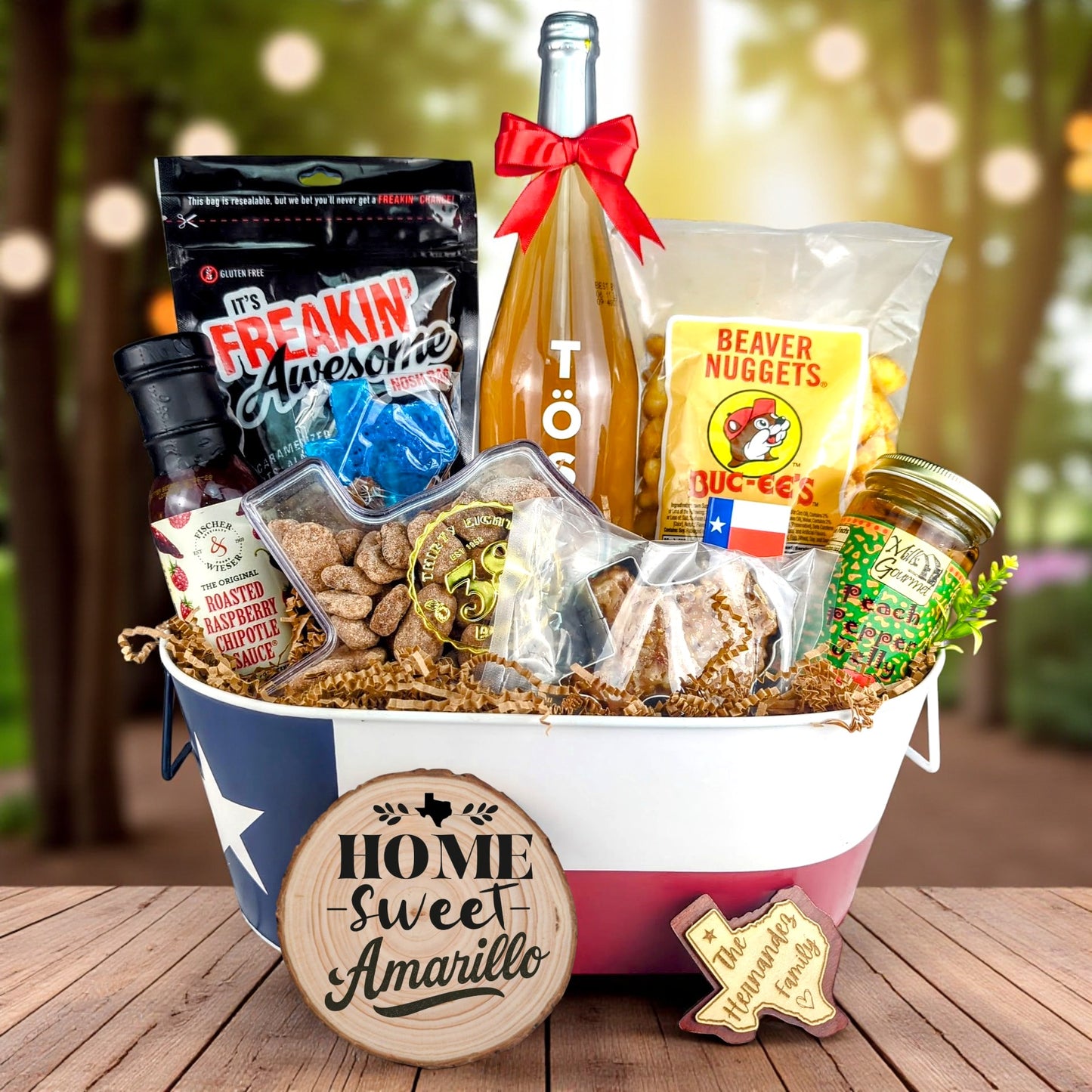 Amarillo Texas Home Celebration Toast & Treats basket with TÖST ROSÉ, Peach Pepper Jelly, Buc-ee’s Beaver Nuggets, Texas pecans, praline, chipotle sauce, and Texas flag tin