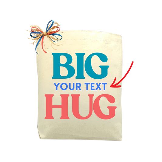 Canvas bag with 'BIG YOUR TEXT HUG' text and a colorful bow on a white background