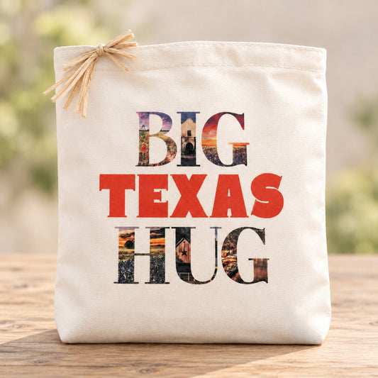 Big Texas Hug cream gift tote with Texas photographic lettering, red TEXAS text and natural raffia in a minimal setting
