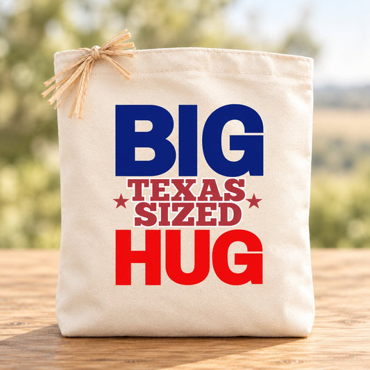 Big Texas-Sized Hug cream gift tote with navy and red lettering and natural raffia