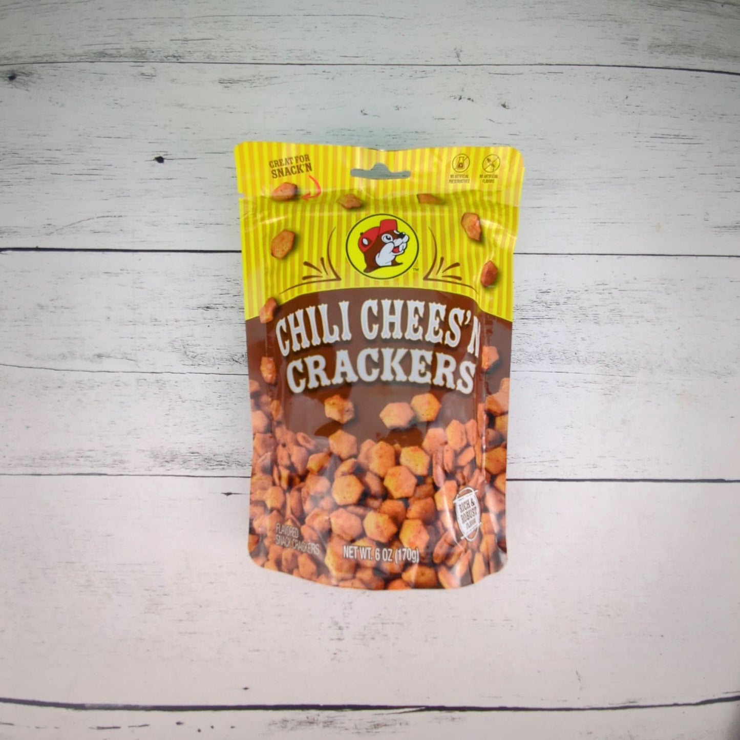 a 6oz package of bucees chili cheese crackers, available for inclusion in a texas-themed gift basket, box, or tote