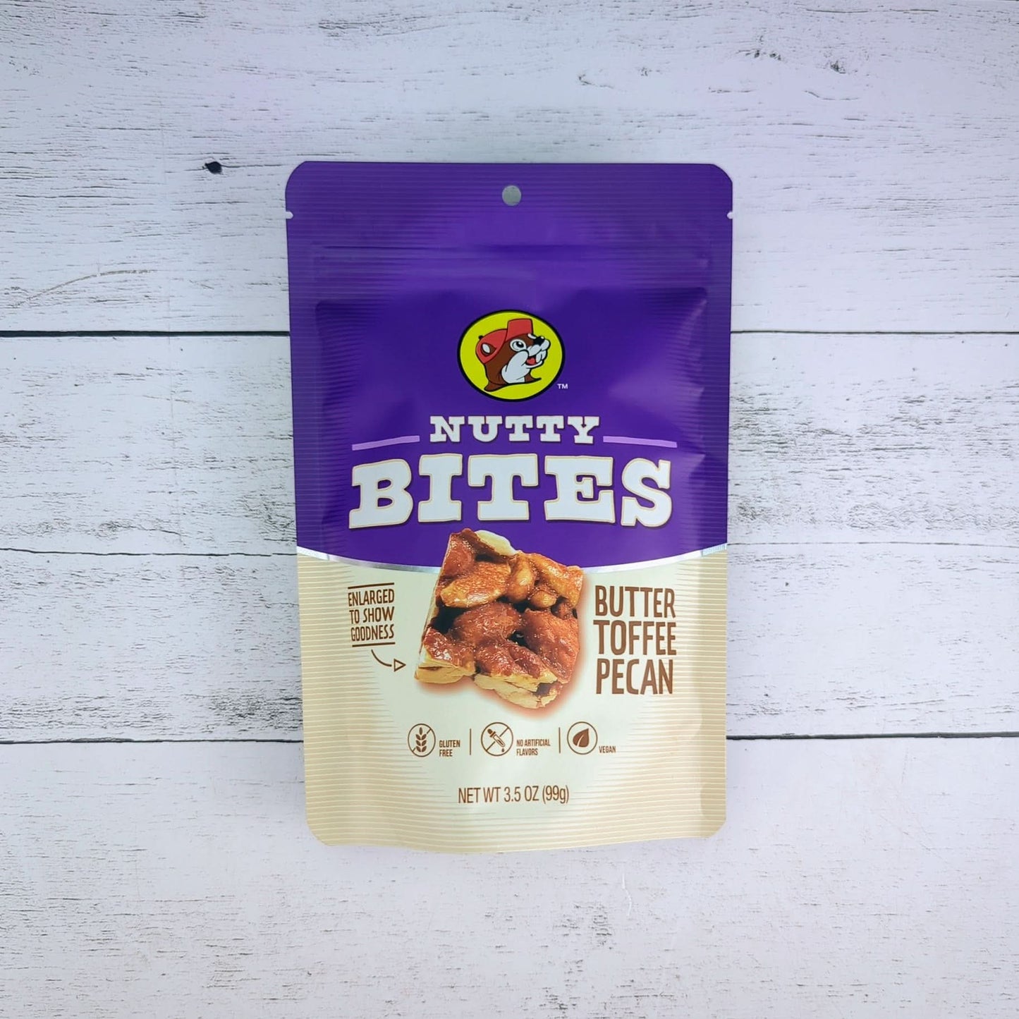 a 3.5 oz package of bucees nutty bites, a butter toffee pecan snack available for inclusion in a texas-themed gift