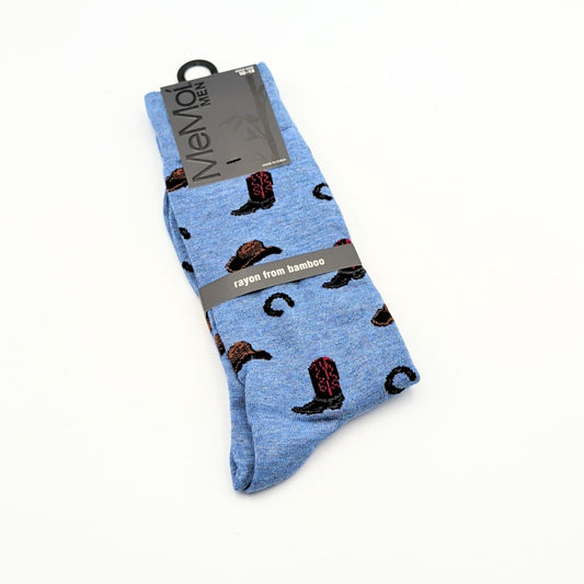 Blue bamboo rayon crew socks for men featuring a cowboy boot and horseshoe pattern on a soft denim-heather background, displayed in retail packaging.