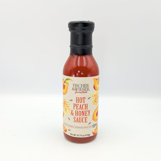 Bottle of Fischer & Wieser Hot Peach & Honey Sauce with peach and honeycomb label artwork, displayed on a white background for gourmet Texas gift baskets and specialty food collections