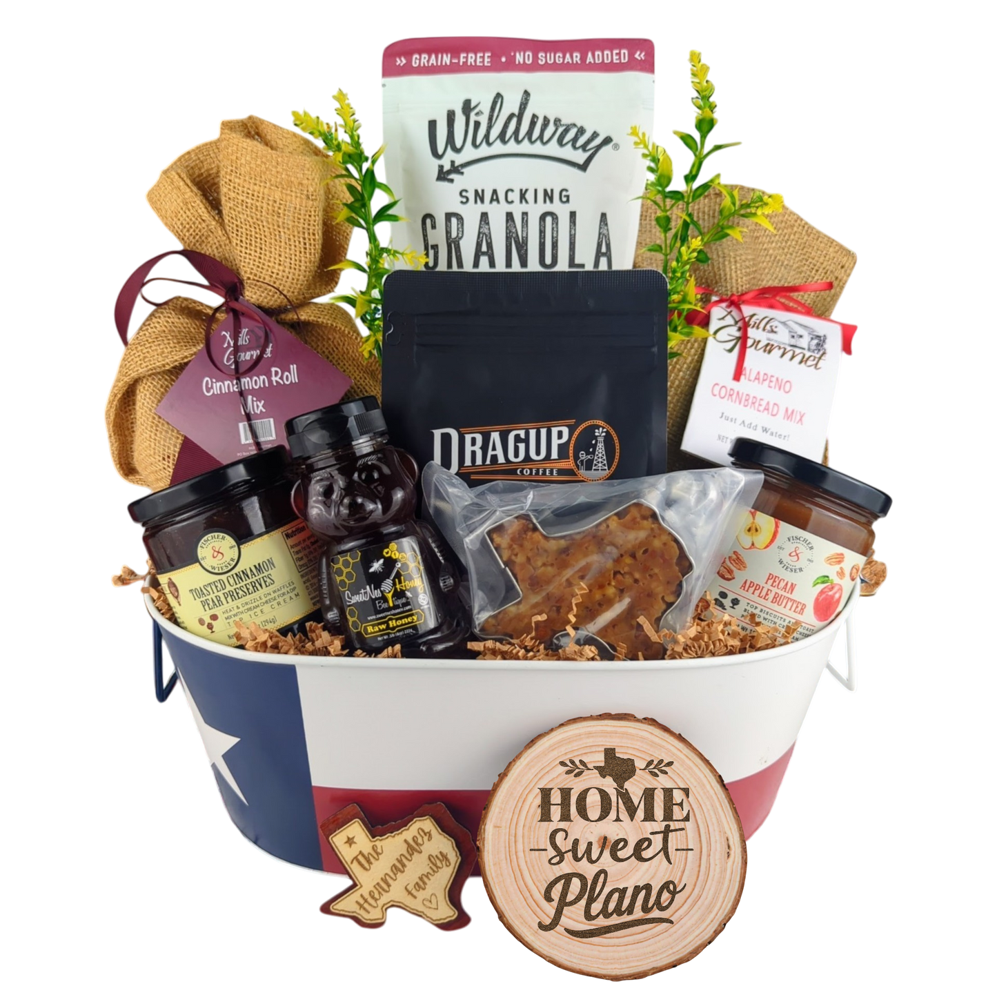 Plano Texas Breakfast Basket on a white background, showcasing pecan coffee, granola, cinnamon rolls, jalapeño cornbread mix, pecan apple butter, raw honey, and praline.