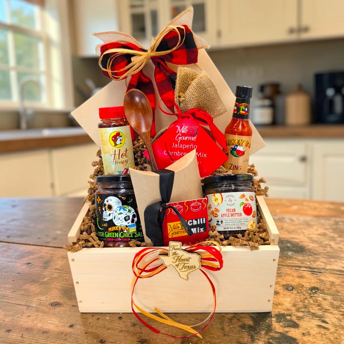 Texas Chili Supper Gift Box arranged in a pine wood box with chili, cornbread, hot honey, salsa, apple butter and wooden spoon