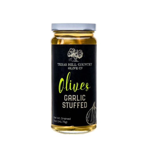 Jar of Texas Hill Country Olive Co. garlic-stuffed olives with black label