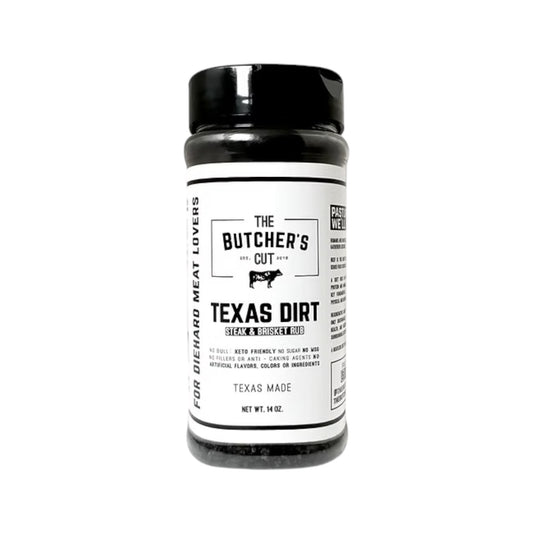 Bottle of The Butcher’s Cut Texas Dirt steak and brisket rub with a black lid and white label, featuring bold black typography, a cow icon, and text indicating Texas-made seasoning, photographed on a white background