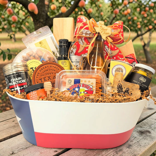 The Texas Hospitality Collection arranged in a Texas flag tin with western ribbon