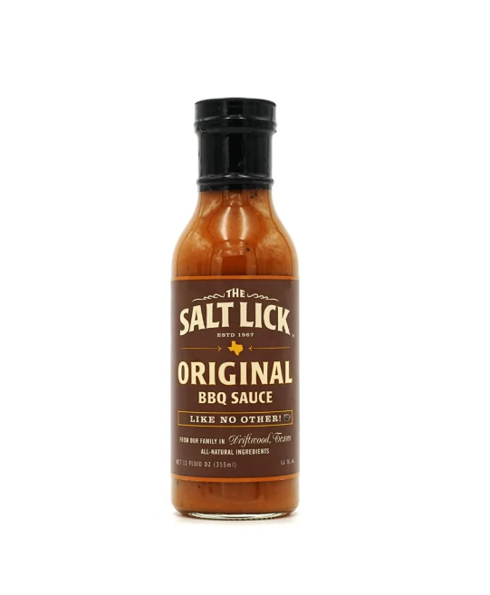 A bottle of The Salt Lick BBQ Original Sauce with a label that includes the brand name and the phrase 'est. 1972', indicating its establishment year.