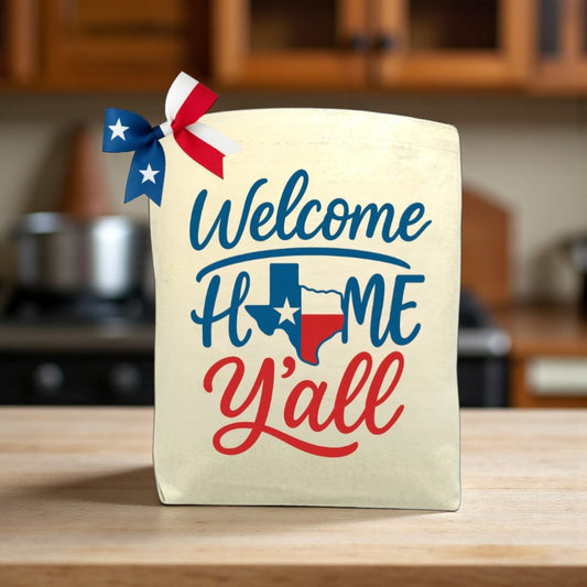 Welcome Home Y’all canvas tote bag with Southern-inspired design, perfect for housewarming or everyday use