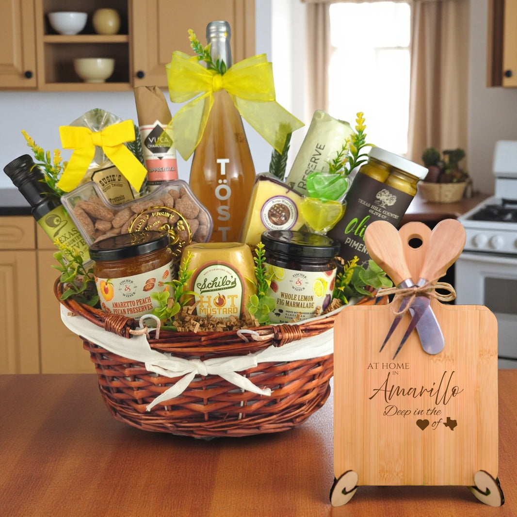 A gourmet gift basket filled with preserves, mustard, olive oil, and more, featuring the At Home in Amarillo Charcuterie Board, celebrating Texas pride.