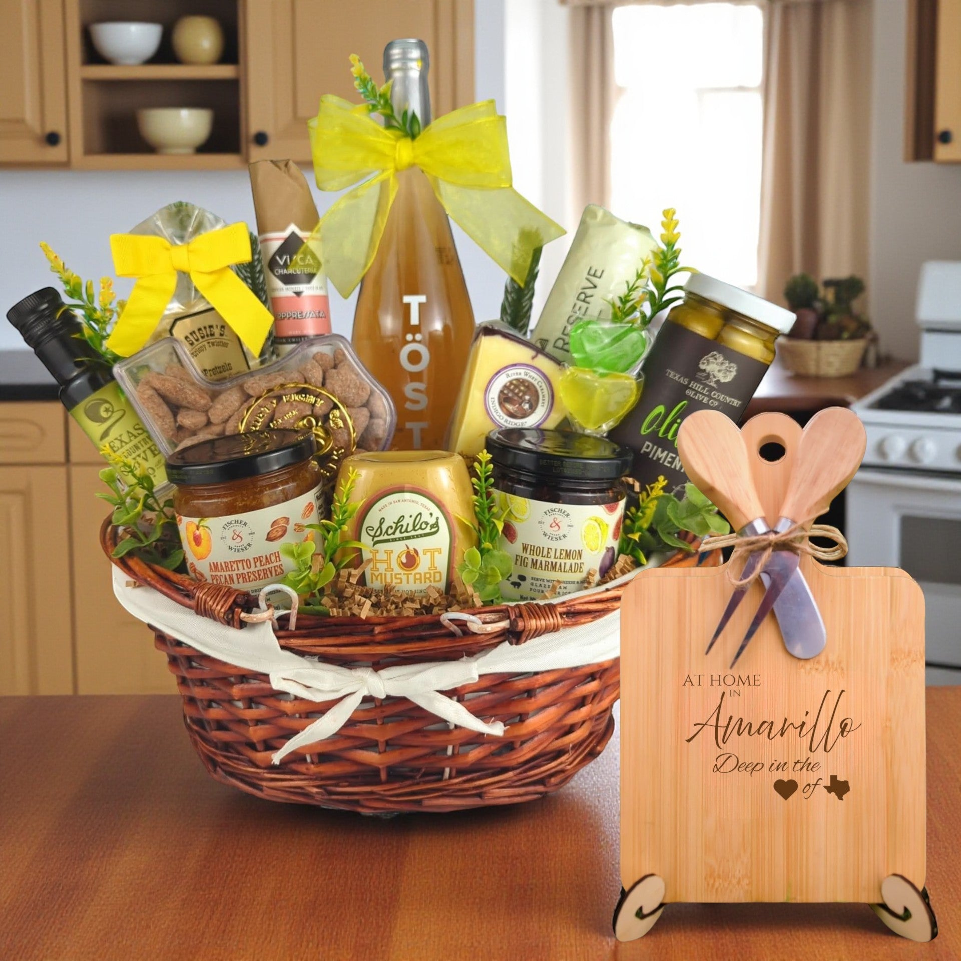 A gourmet gift basket filled with preserves, mustard, olive oil, and more, featuring the At Home in Amarillo Charcuterie Board, celebrating Texas pride.