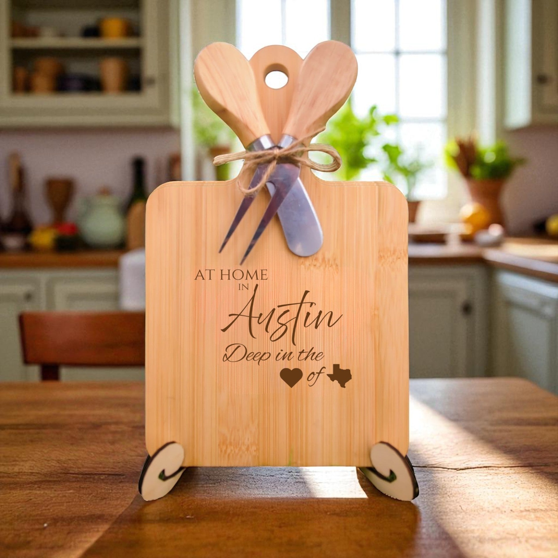 The At Home in Austin Charcuterie Board with laser-engraved Texas silhouette and “At Home in Austin” text, displayed in a warm kitchen setting, ideal for entertaining and Texas pride.
