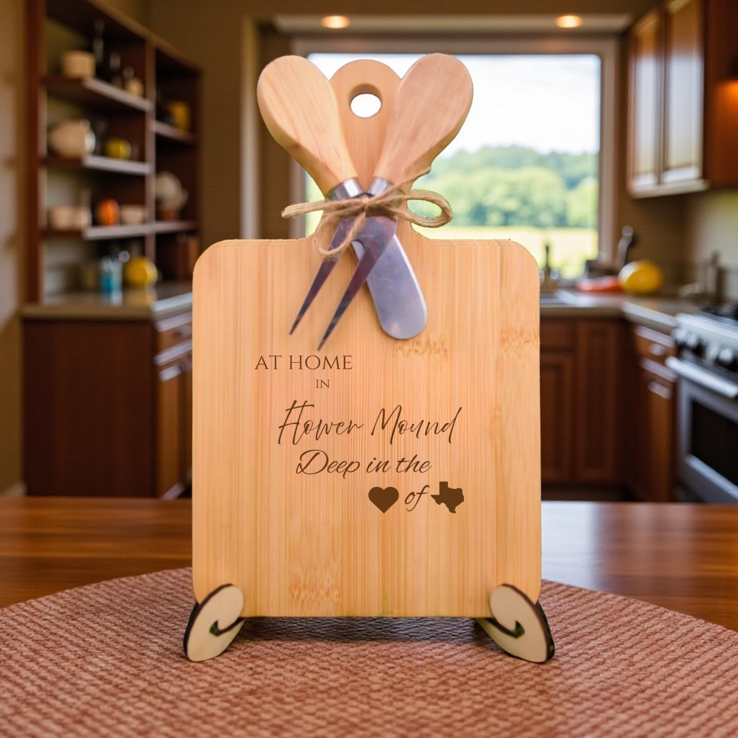 The At Home in Flower Mound Charcuterie Board with laser-engraved Texas silhouette and “At Home in Flower Mound” text, displayed in a cozy kitchen, ideal for entertaining and Texas pride.