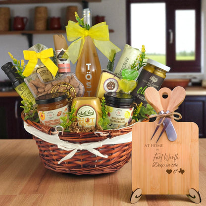 A gourmet gift basket paired with the At Home in Fort Worth Charcuterie Board, featuring bamboo wood, rustic utensils, and engraved Texas design, perfect for celebrating Fort Worth’s rich Texas heritage.