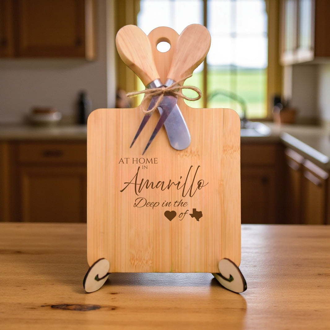 Bamboo charcuterie board engraved with “At Home in Amarillo, Deep in the Heart of Texas” displayed in a kitchen setting