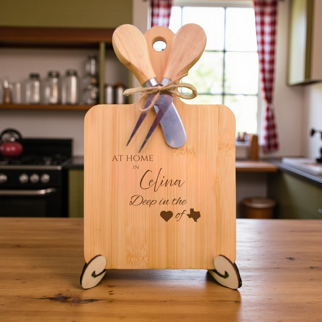 Bamboo charcuterie board engraved with “At Home in Celina, Deep in the Heart of Texas” displayed in a cozy kitchen setting.