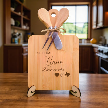 Bamboo charcuterie board engraved with “At Home in Llano, Deep in the Heart of Texas” displayed in a kitchen setting.