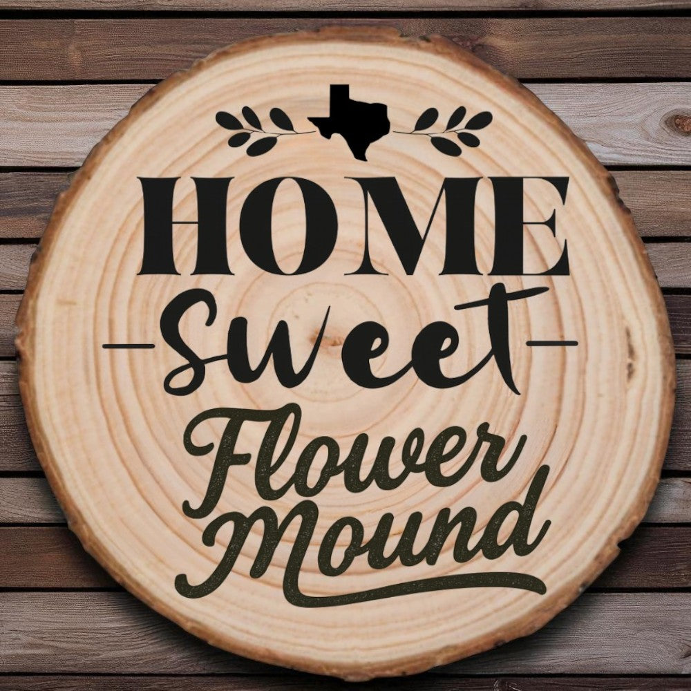 Rustic wood slice coaster with “Home Sweet Flower Mound” laser engraving, Texas silhouette, and leafy accents on wood background