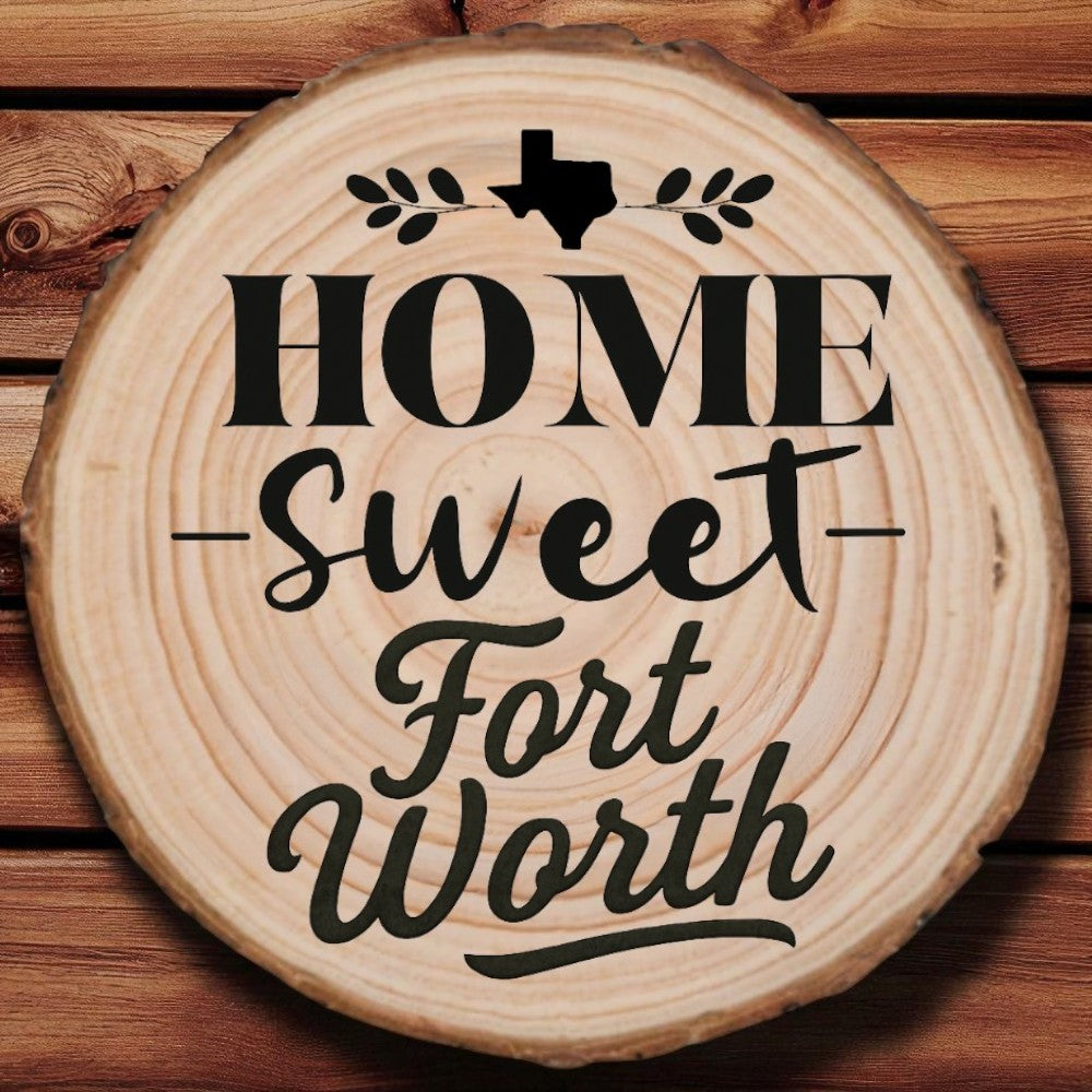 Rustic wood slice coaster with “Home Sweet Fort Worth” laser engraving, Texas silhouette, and leafy accents on wood background