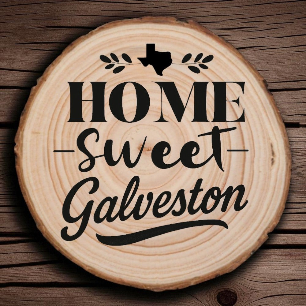 Rustic wood slice coaster with “Home Sweet Galveston” laser engraving, Texas silhouette, and leafy accents on wood background.
