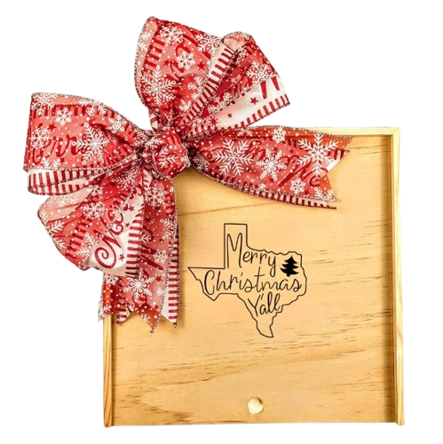 Merry Christmas Y’all Wood Gift Box with a festive red snowflake bow and a “Merry Christmas Y’all” design, surrounded by holiday greenery and berries.