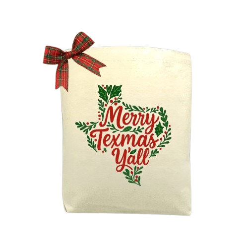 Merry Texmas Y’all Gift Tote Bag made from durable cotton canvas with festive Texmas-themed lettering, styled for holiday gifting and Texas-inspired celebrations.