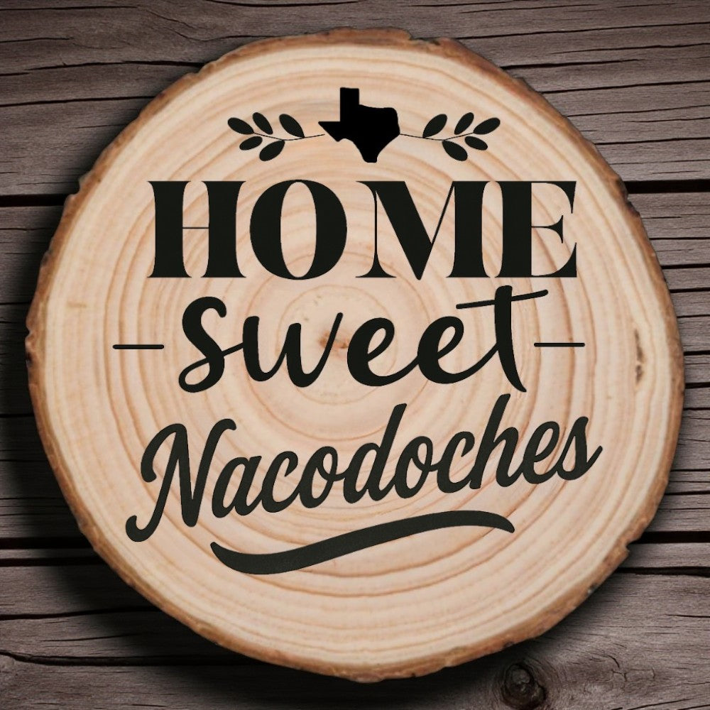 Rustic wood slice coaster with “Home Sweet Nacogdoches” laser engraving, Texas silhouette, and leafy accents on wood background.